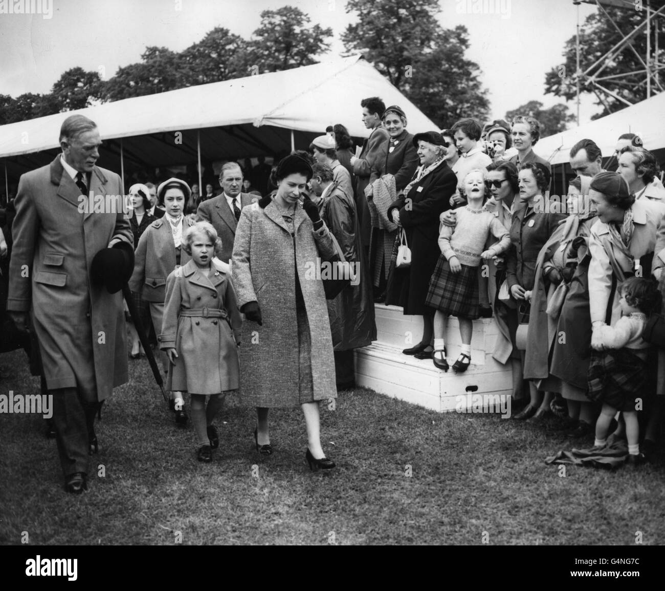 Princess Anne walks with Queen Elizabeth II as they arrive with Princess Margaret to watch events at the Royal Windsor Horse Show, Home Park, Windsor. Stock Photo