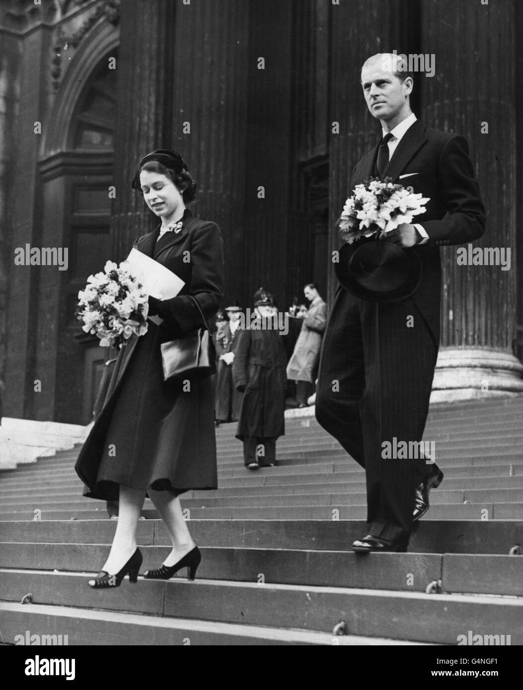 Queen Elizabeth II and the Duke of Edinburgh, carrying their traditional posies, leave St Paul's Cathedral after the Royal Maundy Service. The newly-minted Maundy coins are the first to bear the Queen's effigy. The service is usually held in Westminster Abbey but Coronation preparations made this impossible. Stock Photo