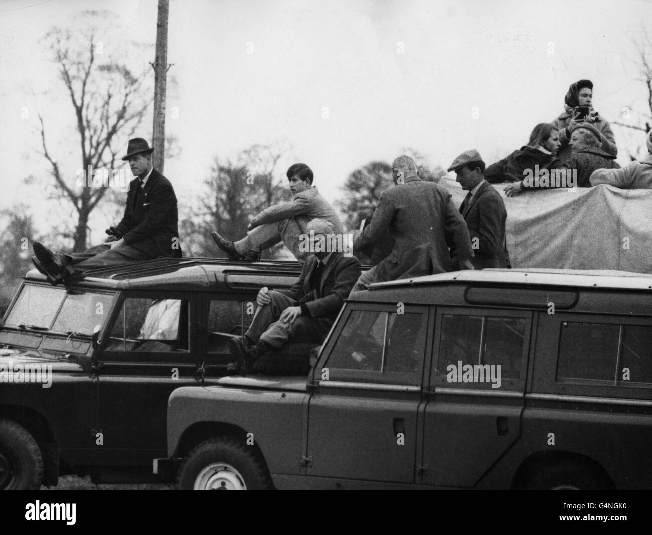 Queen Elizabeth II and Princess Anne, top right, and the Duke of Edinburgh with the Prince of Wales, (on roof of a Land Rover on left) at the Three day Horse Trials at Badminton. Stock Photo