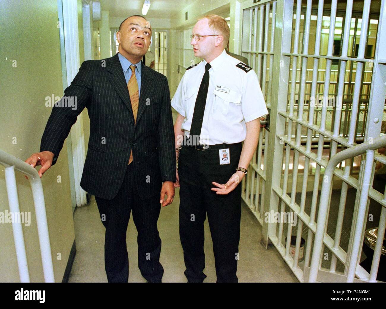 Minister for Prisons Paul Boateng (L) is shown round the A wing of Whitemoor high security prison in Cambridgeshire by Richard Chester, during his first visit to a prison following his appointment to the post as part of a Government reshuffle 29/7/99. Stock Photo