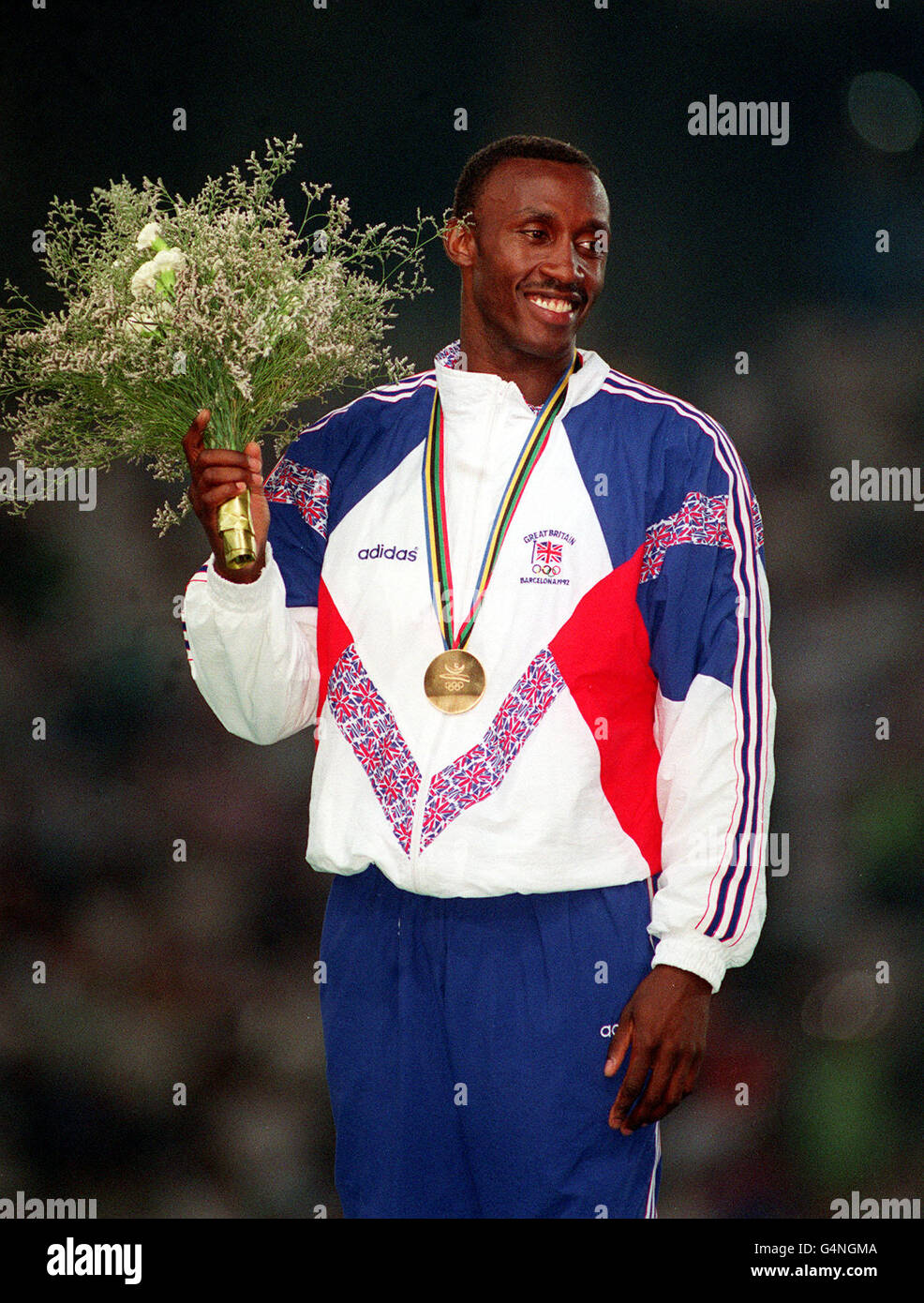 British athlete Linford Christie with his Gold Medal after his victory in the 100m final, at the 1992 Barcelona Olympic Games. 4/8/99: Christie failed a drugs test at an indoor meeting at Dortmund, Germany, on 13/2/99 it was confirmed. Stock Photo