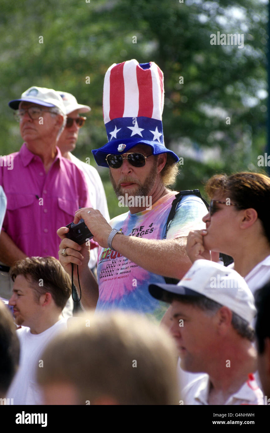 A spectator takes photos whilst wearing an 'Uncle Sam' style hat, during the 1996 Olympic Games in Atlanta. Stock Photo