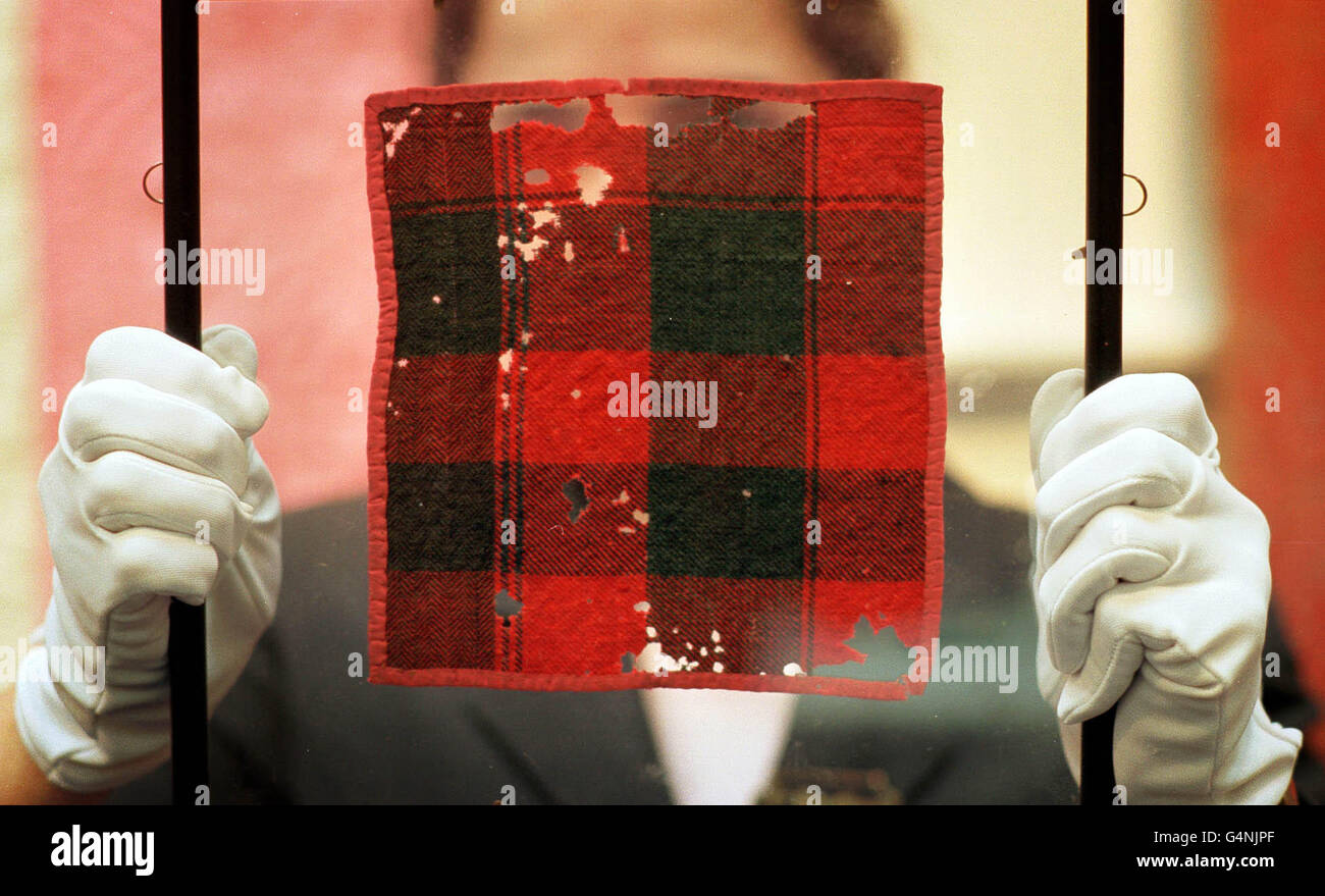 Viewing Lady Clare Arbuthnott displays a mid-18th century fragment of plaid belonging to Prince Charles Edward Stuart (Bonnie Prince Charlie), which was sold at Phillips auctioneers in Edinburgh for 1,650 pounds Stock Photo