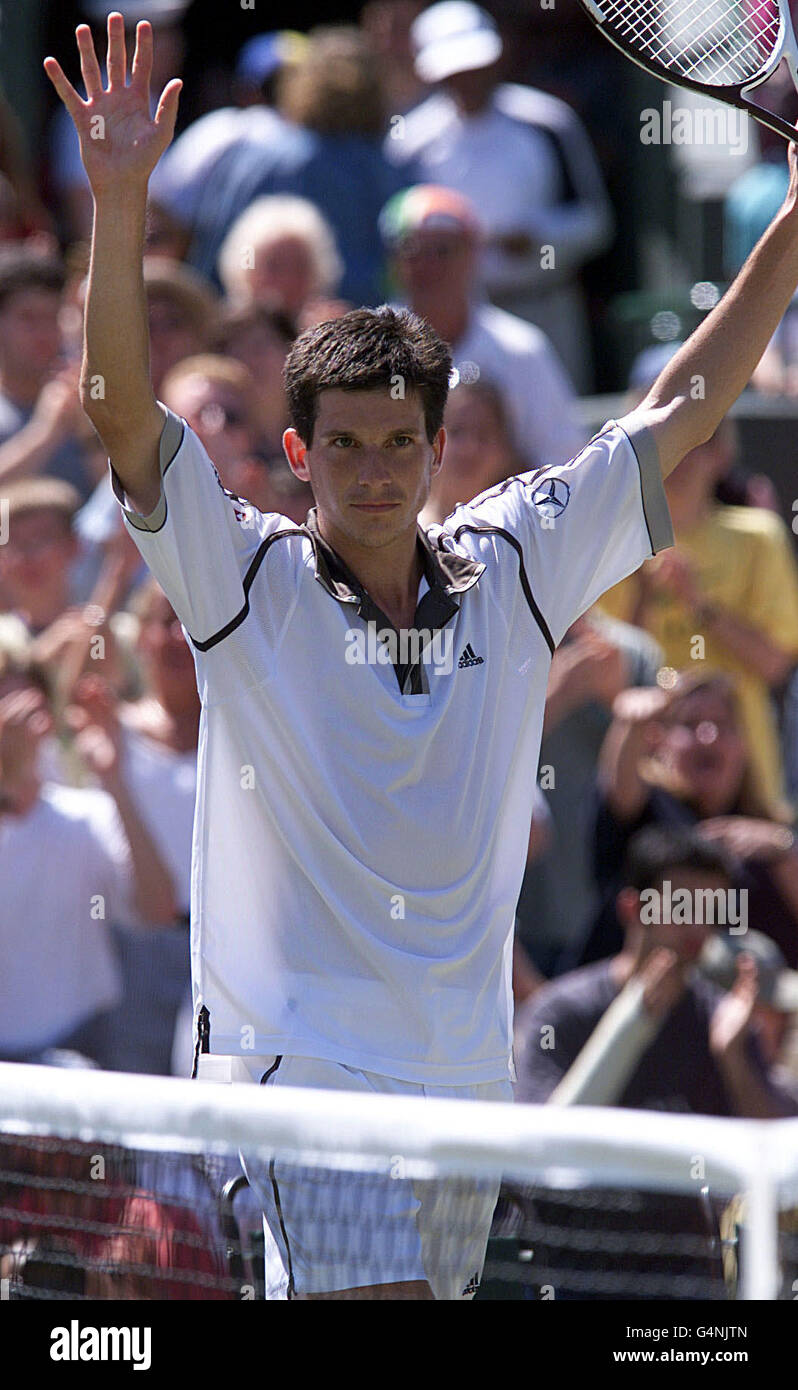 No Commercial Use: British tennis star Tim Henman celebrates after winning his quarter final match against Cedric Pioline of France at Wimbledon. Henman won the match 6-4, 6-2, (4-6) 6-3. Stock Photo
