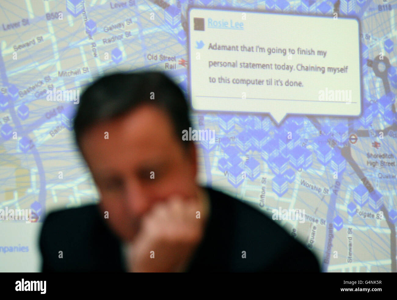 Prime Minister David Cameron sits in front of an interactive map during a visit to internet company The Trampery in Shoreditch, London, after he challenged smaller firms to get out of their 'comfort zone' and export goods abroad as he announced that &pound;95 million is to be made available for investment. Stock Photo
