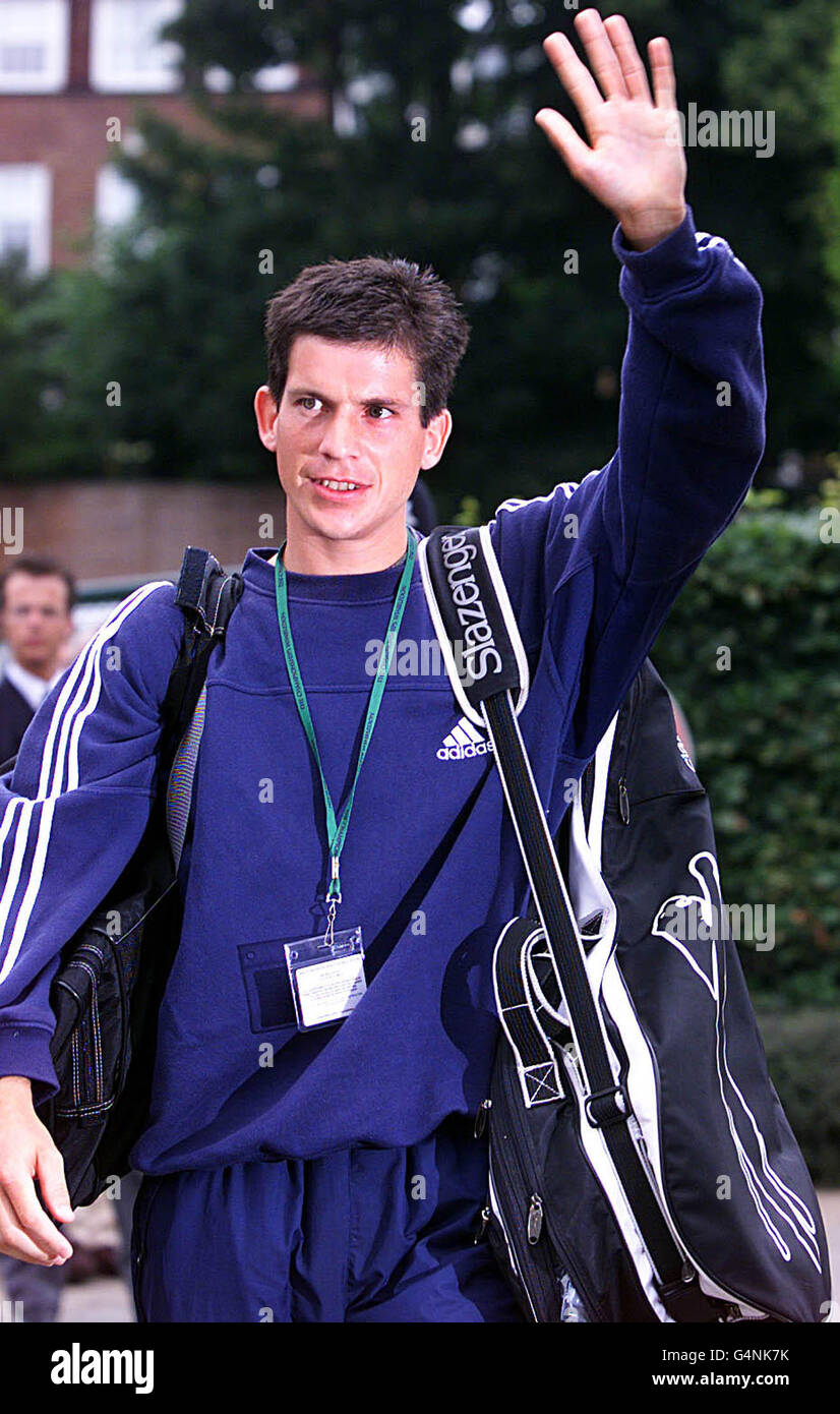 No Commercial Use. British tennis star Tim Henman waves to his fans as he arrives at Wimbledon. Henman will play American Pete Sampras in the semi-final. Stock Photo