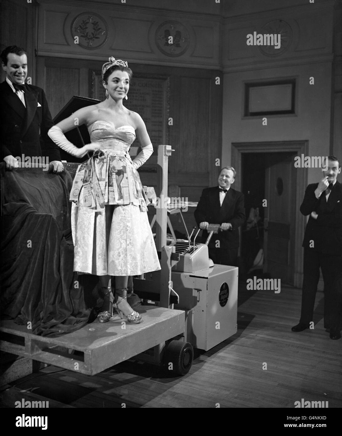 Wearing her regalia after being elected 'Miss Press Cuttings' is young actress Joan Collins. Miss Collins was awarded the title at the annual ball of the Trade and Technical Branch of the National Union of Journalists, held at the Royal Empire Society Rooms, Craven Street. The title is for the up-and-coming film star who had received the greatest amount of publicity and has been most helpful to journalists during the past year. Stock Photo