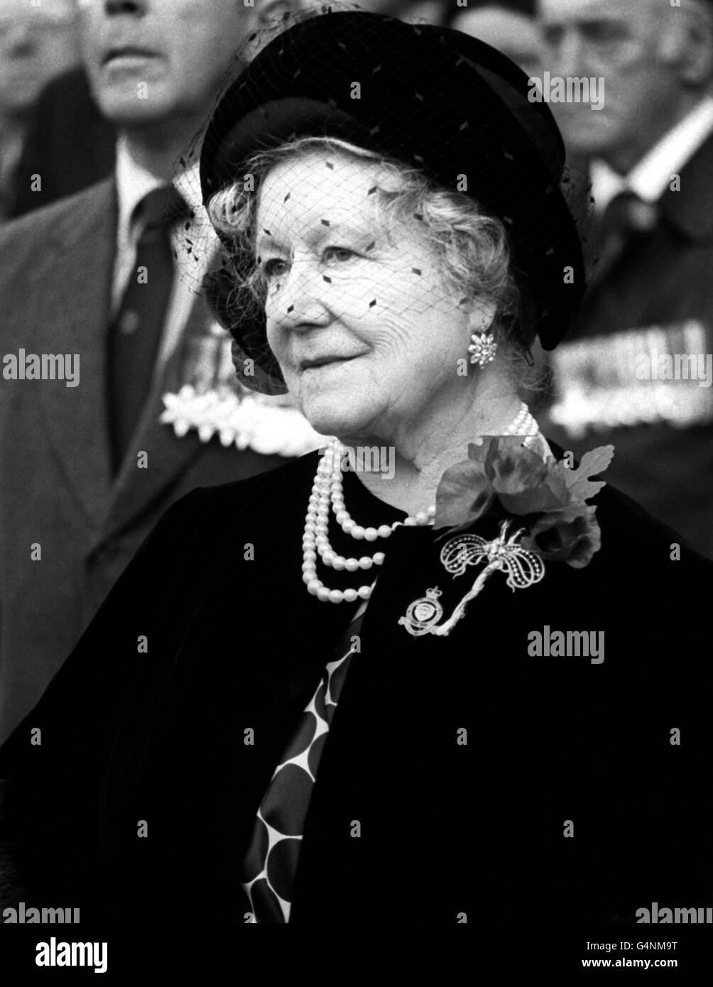 The Queen Mother wearing a large Poppy during a visit to the Field of Remembrance at St Margaret's Church Westminster. Stock Photo