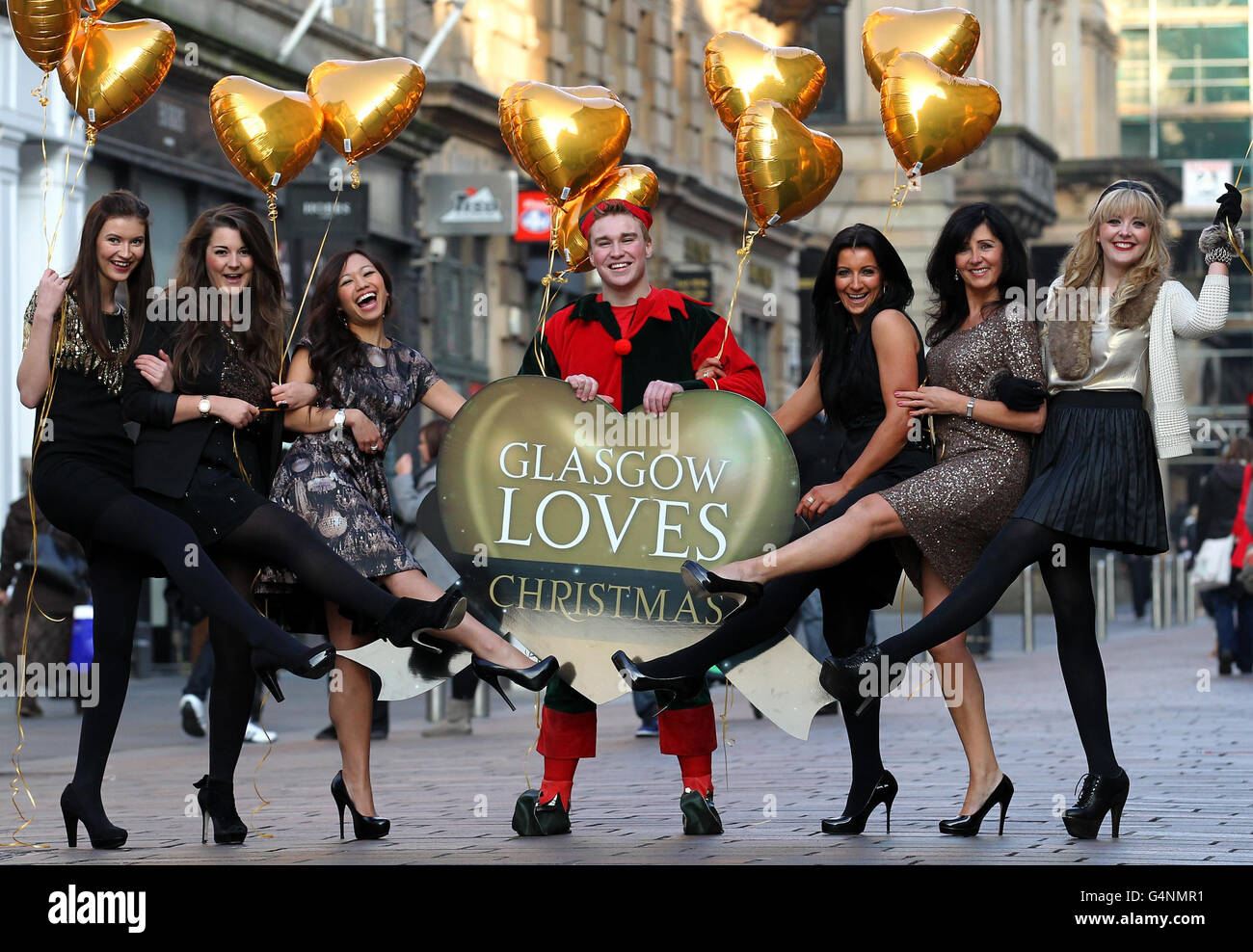 (left - right) Lorna Reoch from Frasers, Christine Robb from Folli Follie, Debbie Chung from Rox (on behalf of Argyll Arcade), James Breadner as an elf from Hamleys, Debbie Lawson from Dower and Hall (on behalf of Princess Square), Cathy McCarthy from John Lewis and Sarah Brand from Oasis in Buchanan Galleries for the Glasgow Loves Christmas campaign 2011 launched in Buchanan Street, Glasgow by representatives from seven of the city's leading retailers. Stock Photo