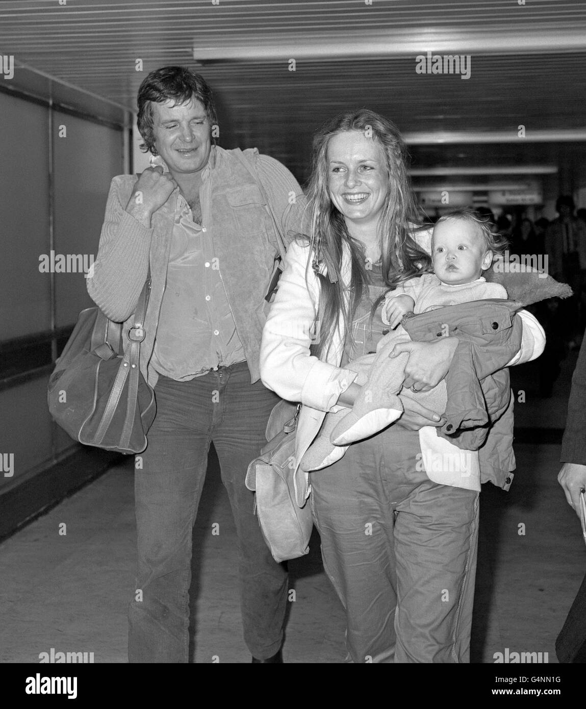 Model and singer Twiggy, with her husband Michael Whitney and daughter Carly, after arriving at Heathrow Airport from America for a Christmas holiday in Britain. Stock Photo