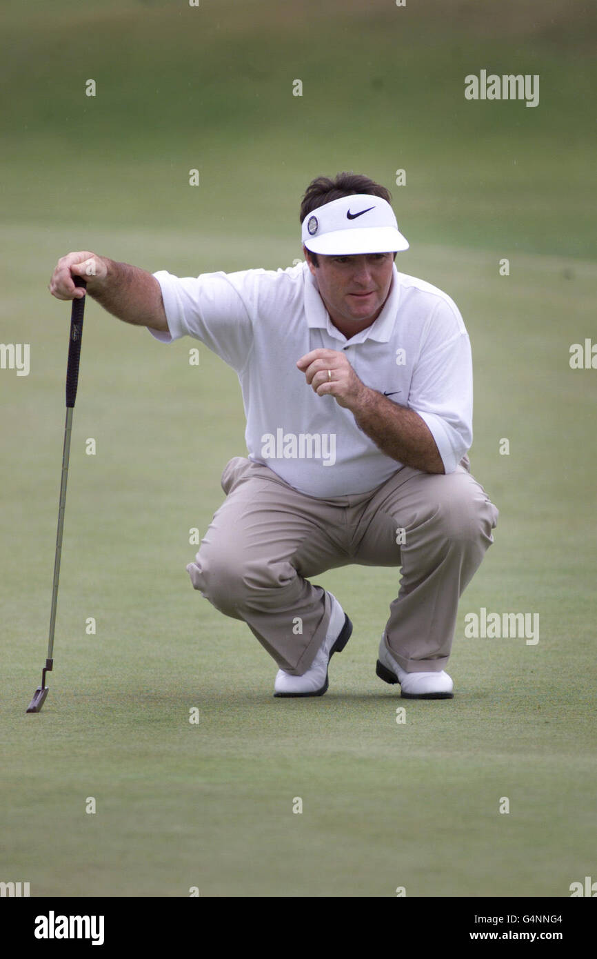 Australia's Craig Parry checks the lie of the green on the 5th green