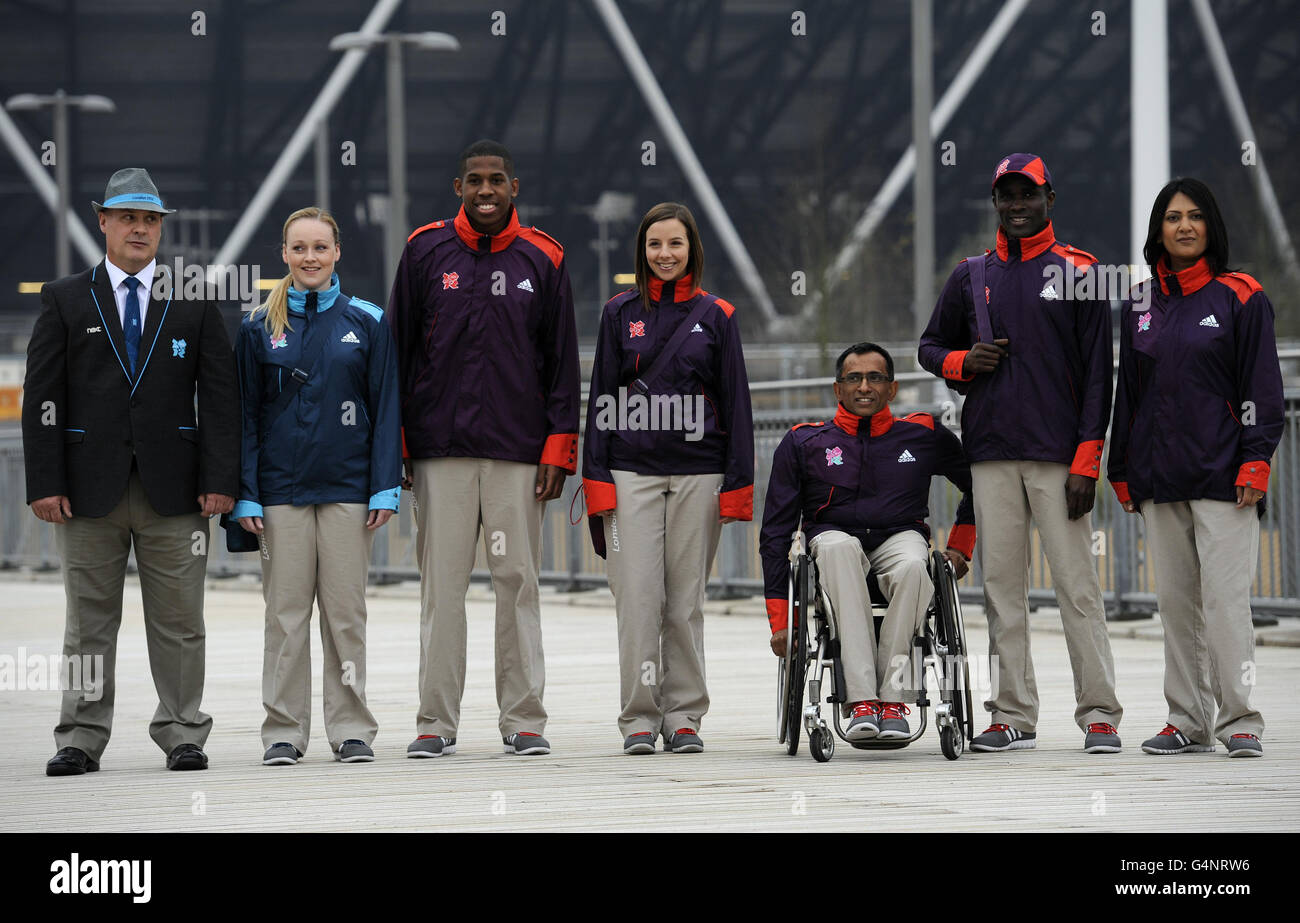 (left to right) John Askew and Louise Matthews in Technical uniforms with Rheiss Brown, Helen Gist, Jayant Mistery, Lade Adanijo and Rita Patel in Game Makers uniforms during the photocall at the Olympics Park, London. Stock Photo