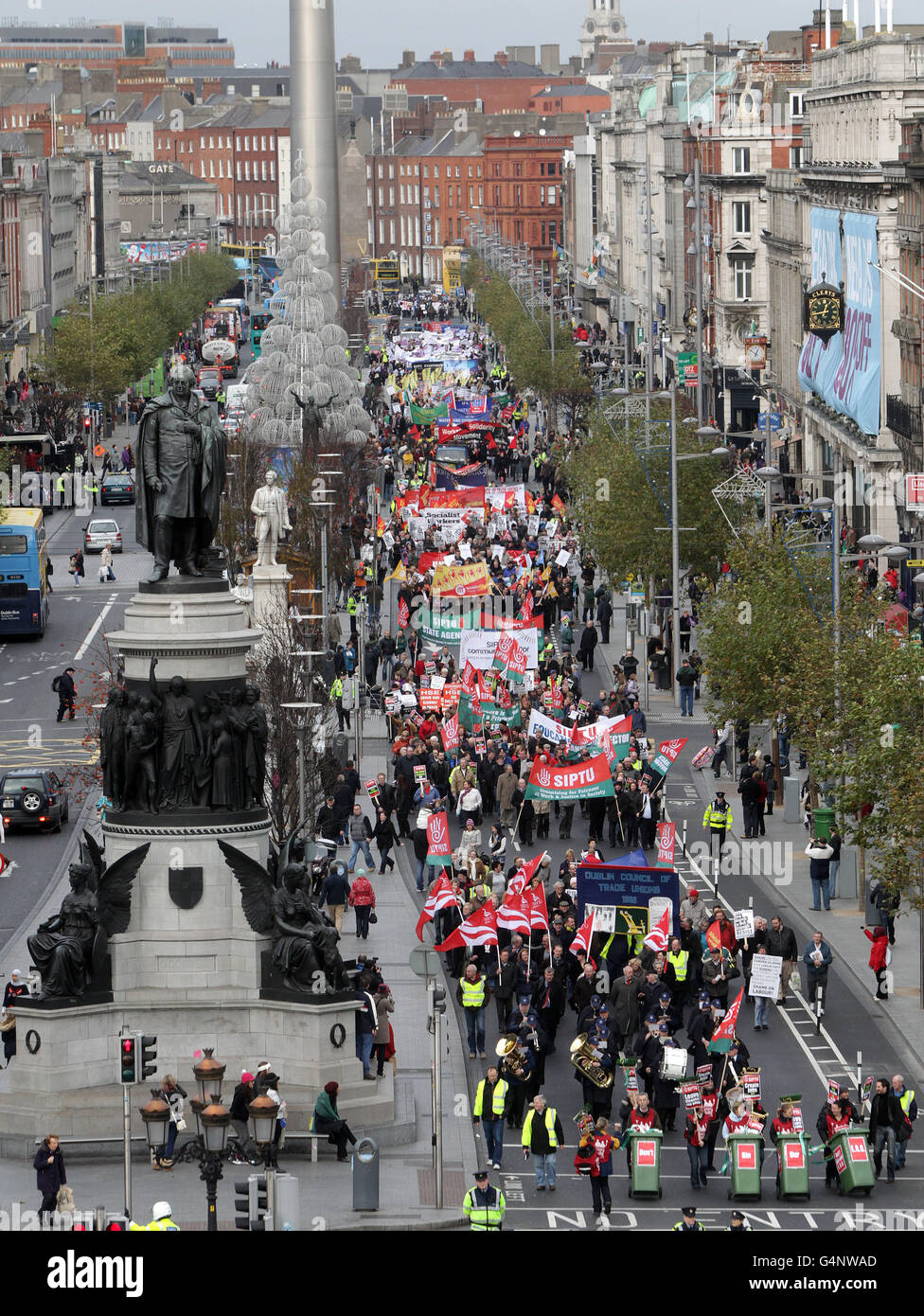 Protestors march on an anti-austerity rally down O'Connell Street, Dublin, en route to the GPO. PRESS ASSOCIATION Photo. Picture date: Saturday November 26, 2011. Up to 2,000 people attended. Hospital cleaners wielding brooms and pushing wheelie bins led the trade union-organised procession. The Dublin Council of Trade Unions coordinated the protest, and Irish Congress of Trade Unions president Eugene McGlone said activists were expressing concern at the implications of the upcoming budget. See PA story INDUSTRY Rally Ireland. Photo credit should read: Niall Carson/PA Wire Stock Photo