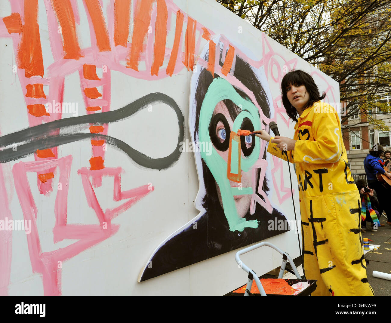 Noel Fielding at work on a giant piece of art created to publicize his new book, in Golden Square central London. Stock Photo