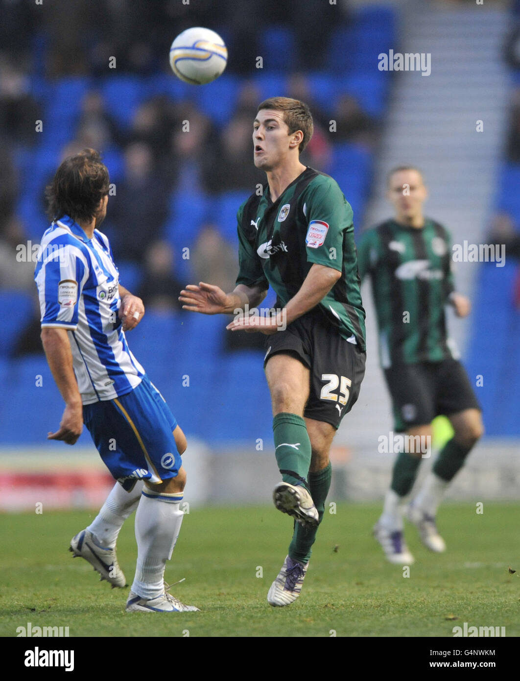 Brighton & Hove Albion's Inigo Calderon and Coventry City's Gary Gardner battle for the ball during the npower Football League Championship match at the AMEX Stadium, Brighton. Stock Photo