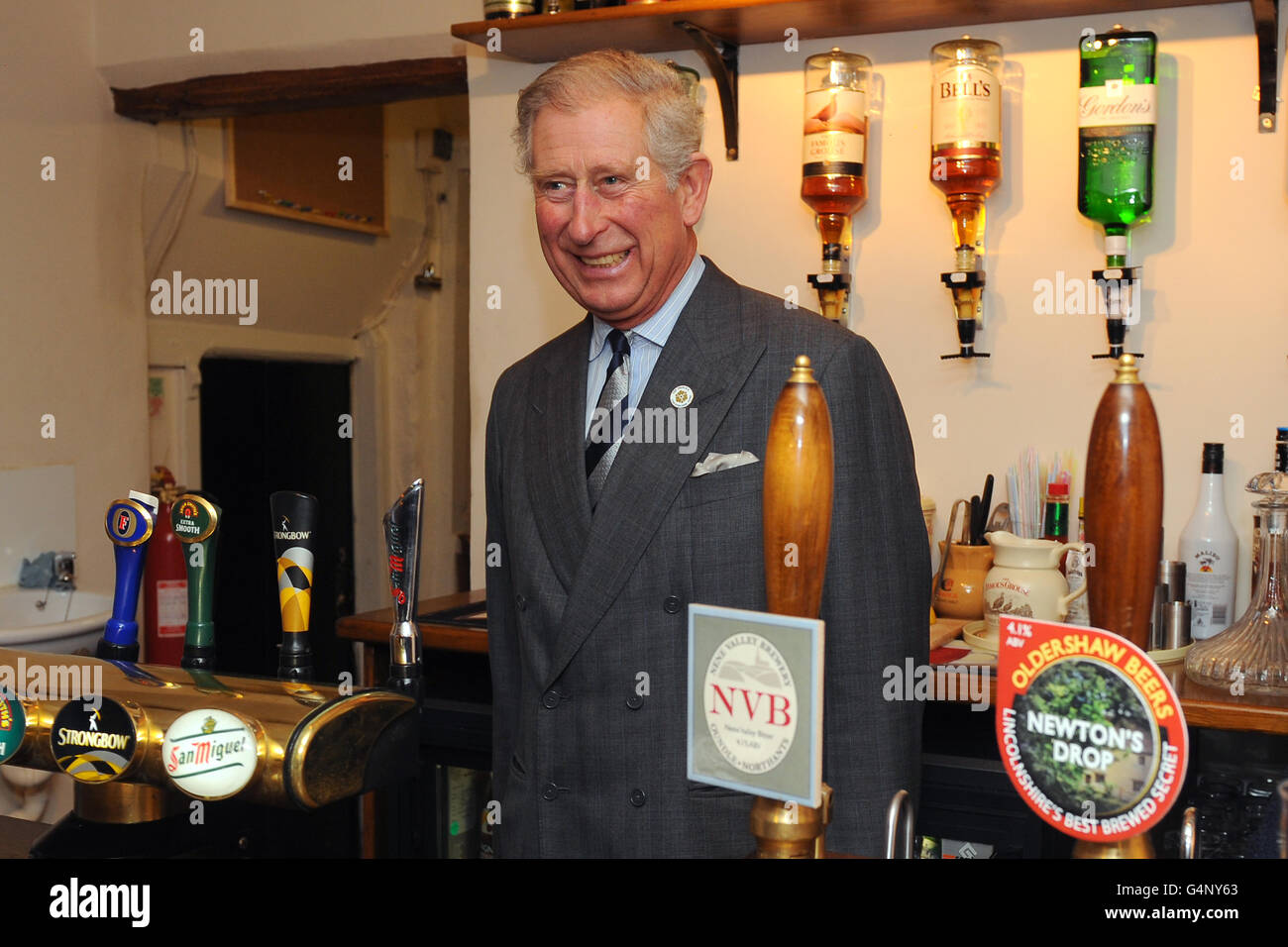The Prince of Wales prepares to pull a pint at the Cholmeley Arms as part  of the Pub is The Hub initiative, Burton Lane, Burton-le-Coggles, Grantham  Stock Photo - Alamy
