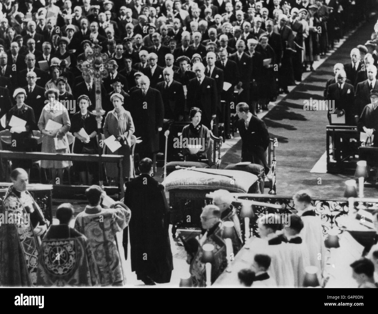 Queen Elizabeth II and the Duke of Edinburgh at St. Paul's Cathedral attending the rededication of the High Altar, which was damaged in London's wartime bombing. Stock Photo