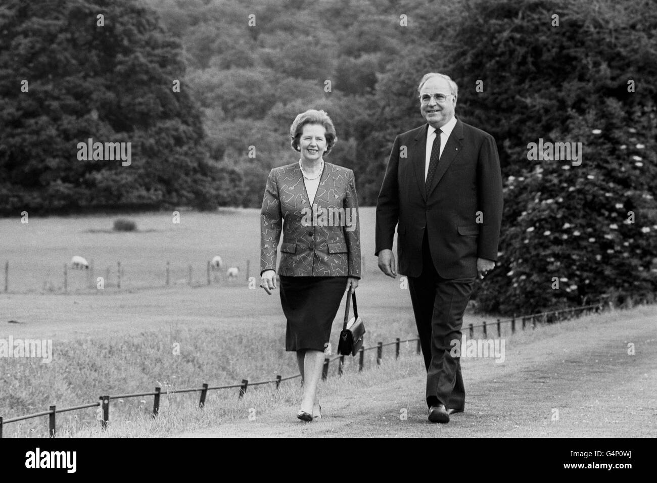 Margaret Thatcher and Chancellor Helmut Kohl of West Germany at ease in the grounds as they had three hours of 'relaxed and very friendly' talks at Chequers, the Prime Minister's country residence. They agreed more emphasis should be laid on the warmth of Anglo-German relations. Stock Photo