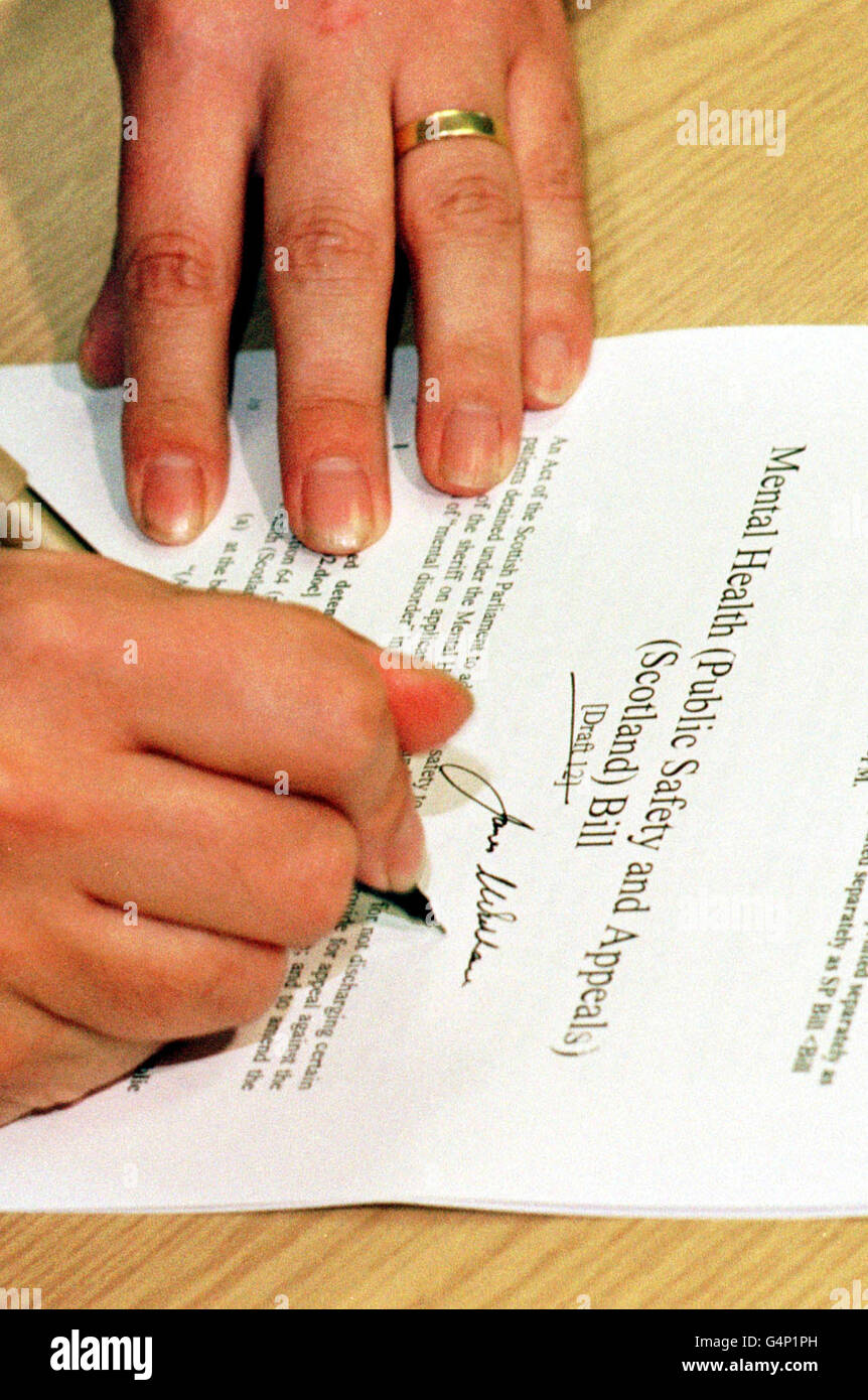 Deputy First Minister Jim Wallace signs the Mental Health (Public Safety and Appeals) (Scotland) Bill. The Bill, is a response to a legal intricacy which allowed convicted murderer Noel Ruddle to be released from the Carstairs State Hospital. * This will be the first piece of legislation to be put before the Scottish Parliament. Stock Photo