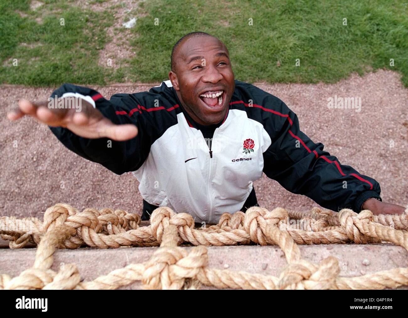 Bath rugby player Victor Ubogu climbs the Royal Marine training wall at Lympstone, Devon. England coach Clive Woodward confirmed the recall of veteran Bath prop Ubogu for his 30-man squad for October's World Cup. Stock Photo