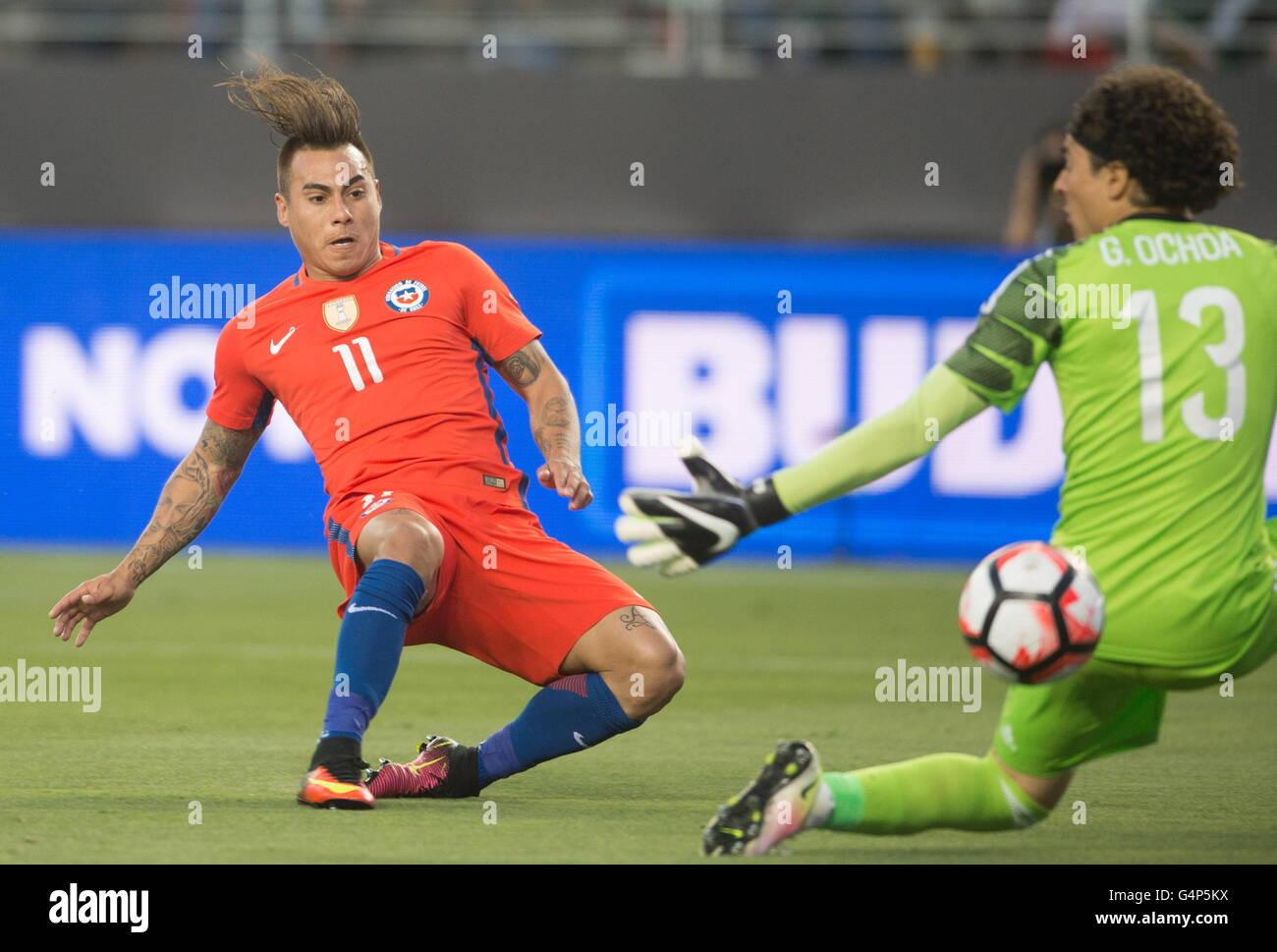 Santa Clara, USA. 18th June, 2016. Eduardo Vargas (L) of Chile scores during the quarterfinal match against Mexico of 2016 Copa America soccer tournament at the Levi's Stadium in Santa Clara, California, the United States, June 18, 2016. Chile won 7-0. Credit:  Yang Lei/Xinhua/Alamy Live News Stock Photo