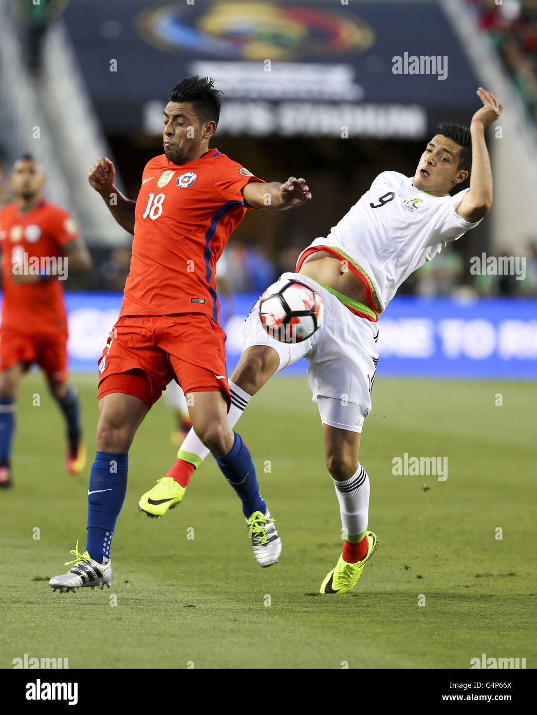 Los Angeles, California, USA. 18th June, 2016. Chile defender Gonzalo Jara #18 vies the ball against Mexico forward Raul Jimenez #9 in the Copa America soccer match between Mexico and Chile at the Levi's Stadium in Santa Clara, California, June 18, 2016. Chile won 7-0. Credit:  Ringo Chiu/ZUMA Wire/Alamy Live News Stock Photo