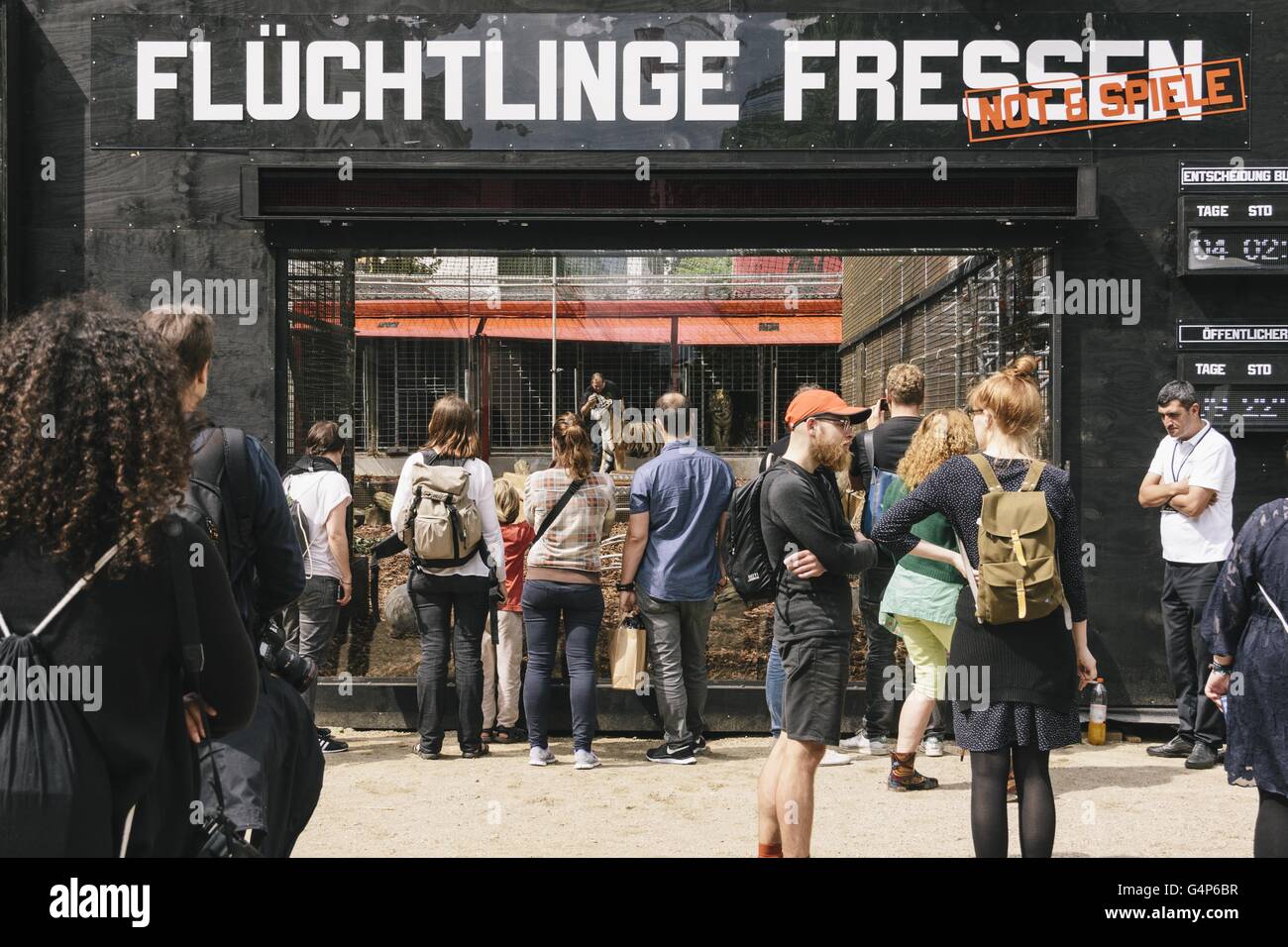 Berlin, Berlin, Germany. 18th June, 2016. Spectators in front of the installation of the project. The political art group 'Center for Political Beauty' (Zentrum fÃ¼r Politische SchÃ¶nheit, ZPS) sets up Roman-style arena for refugees to be devoured by tigers in outside the Maxim Gorki theater in Berlin. © Jan Scheunert/ZUMA Wire/Alamy Live News Stock Photo