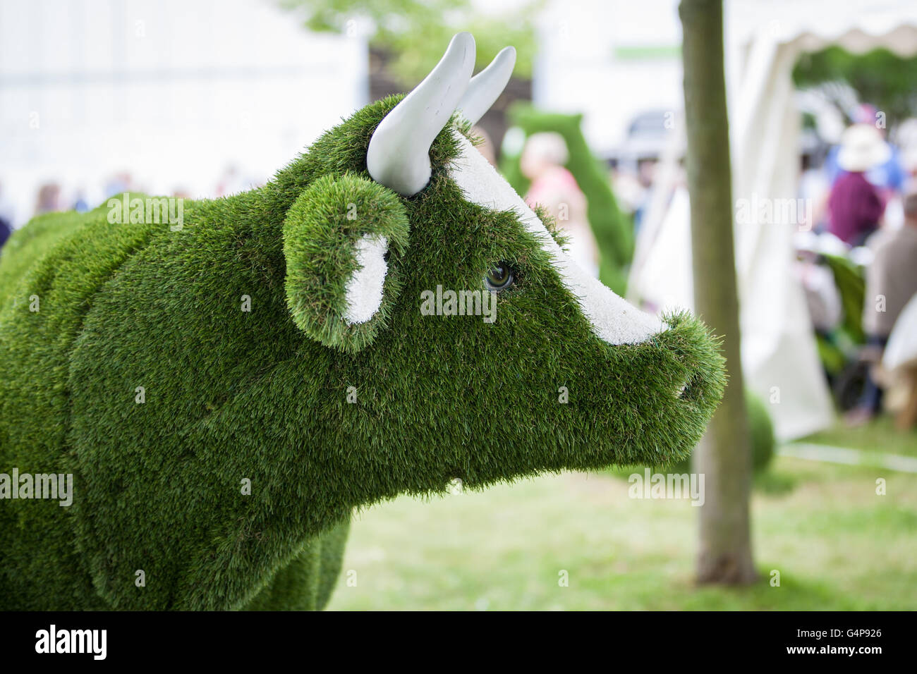 Birmingham, UK. 19th June, 2016.  A Cow made of synthetic grass on display for the public Credit:  steven roe/Alamy Live News Stock Photo