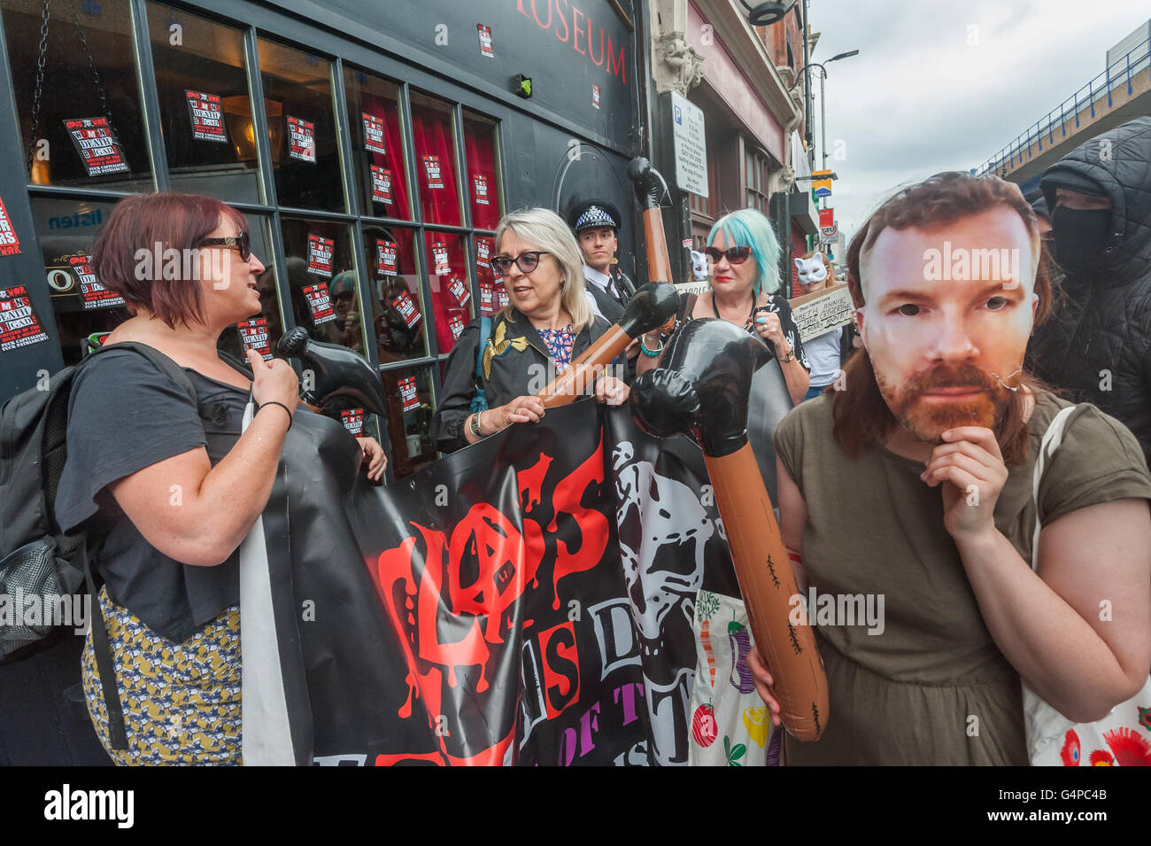 London, UK. 19th June 2016.  Class War and supporters, including one wearing a Mark Palmer-Edgecumbe mask, protest outside the 'Jack the Ripper Museum' tourist attraction on Cable St which has been refused planning permission for its facade and shutter. They brought toy plastic hammers and offered to take it down as the owners have not yet complied with the decision. They say the so-called museum is a tacky tourist attraction that glorifies and profits from the horrific killings of working class women. Peter Marshall/Alamy Live News Stock Photo