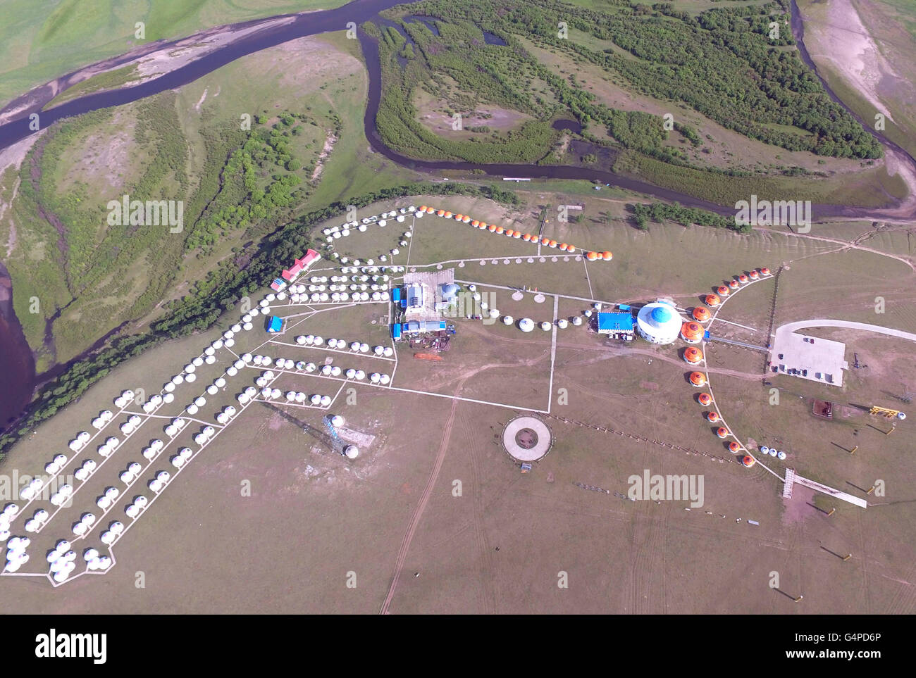 Ewenki Autonomous Banner. 19th June, 2016. Aerial photo taken on June 19, 2016 shows the Mongolian yurts on the pasture in Ewenki Autonomous Banner, Hulunbuir, north China's Inner Mongolia Autonomous Region. © Deng Hua/Xinhua/Alamy Live News Stock Photo