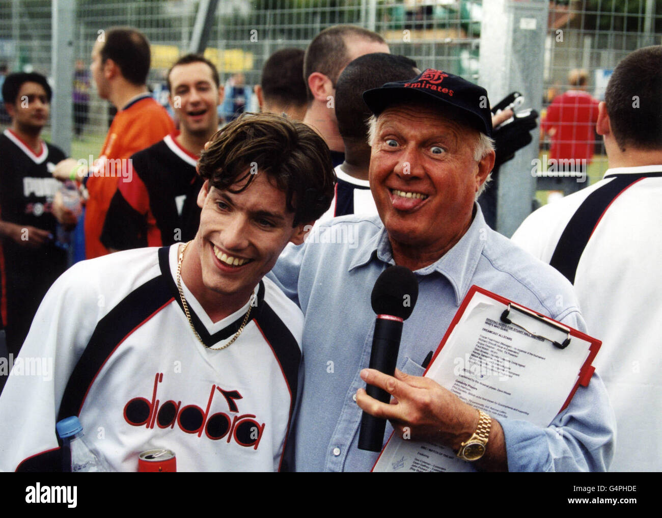 Dean Gaffney (left), who plays Robbie Jackson in Eastenders, with the presenter Stuart Hall, at the Dreamcast Millennium Cup 5-a-side Football Challenge, Tottenham, London. Stock Photo