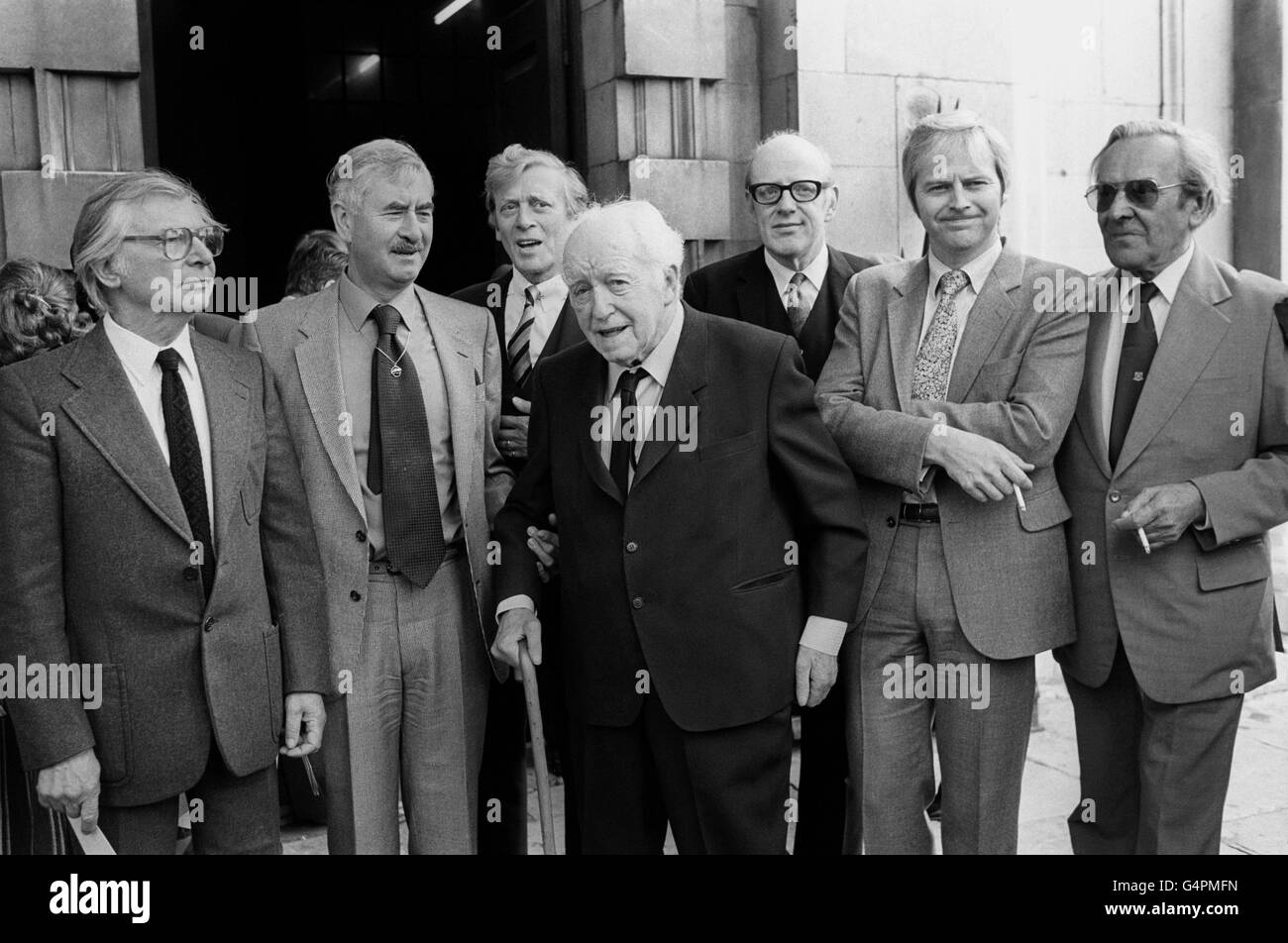 Members of the cast of Dad's Army, at St Martin-in-the-Fields Church after a memorial service for the actor Arthur Lowe (Captain Mainwaring in the programme) who died recently. (l-r) Clive Dunn (Private Jones), Bill Pertwee (ARP Warden), Jimmy Perry (author), Arnold Ridley (Private Godfrey), Frank Williams (The Reverend Timothy Farthing), Ian Lavender (Corporal Pike) and John Le Mesurier (Sgt Wilson). Stock Photo