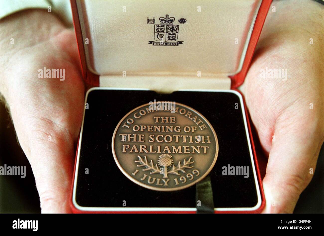 Each of the 129 Scottish Parliamentarians will receive a commemorative brass medal commissioned from the Royal Mint, to mark the opening of the Scottish Parliament. Stock Photo
