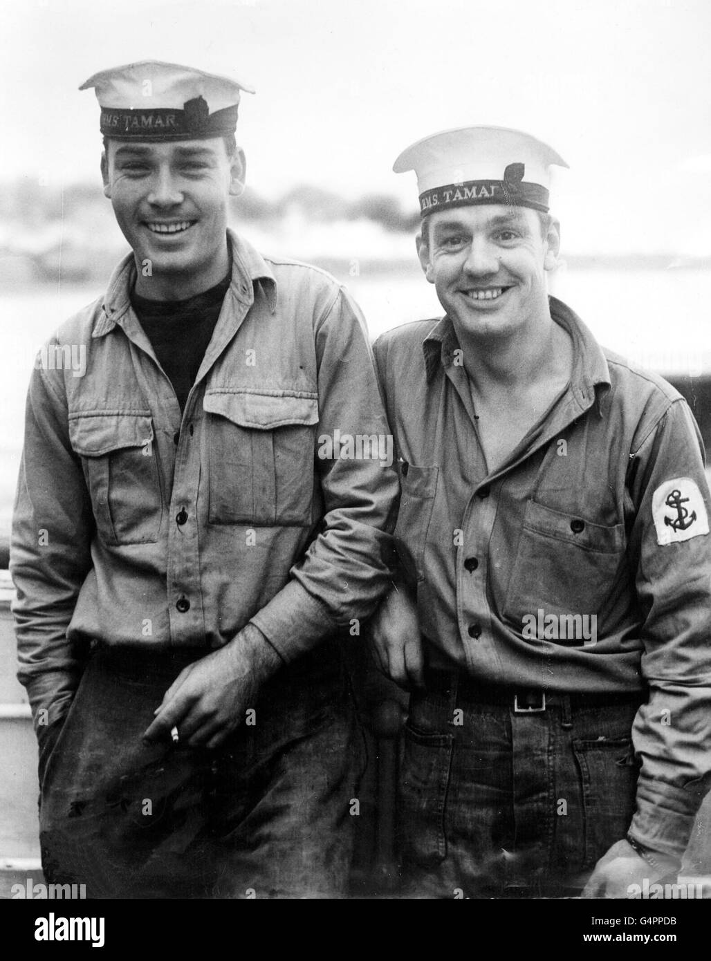 Home after five months as prisoners of the Chinese Communists are two Royal Navy ratings, Able-Seaman G.B Wise (left) and Leading-Seaman R. G. Creswell. They are pictured at Southampton on their arrival from Hong Kong in the troopship SS Dilwara. Stock Photo