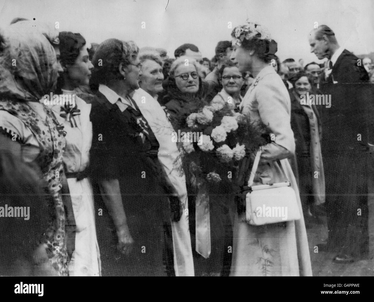 Britain's Queen Elizabeth II holds her handbag as she presides over the  Tynwald ceremony on the Isle of Man Stock Photo - Alamy