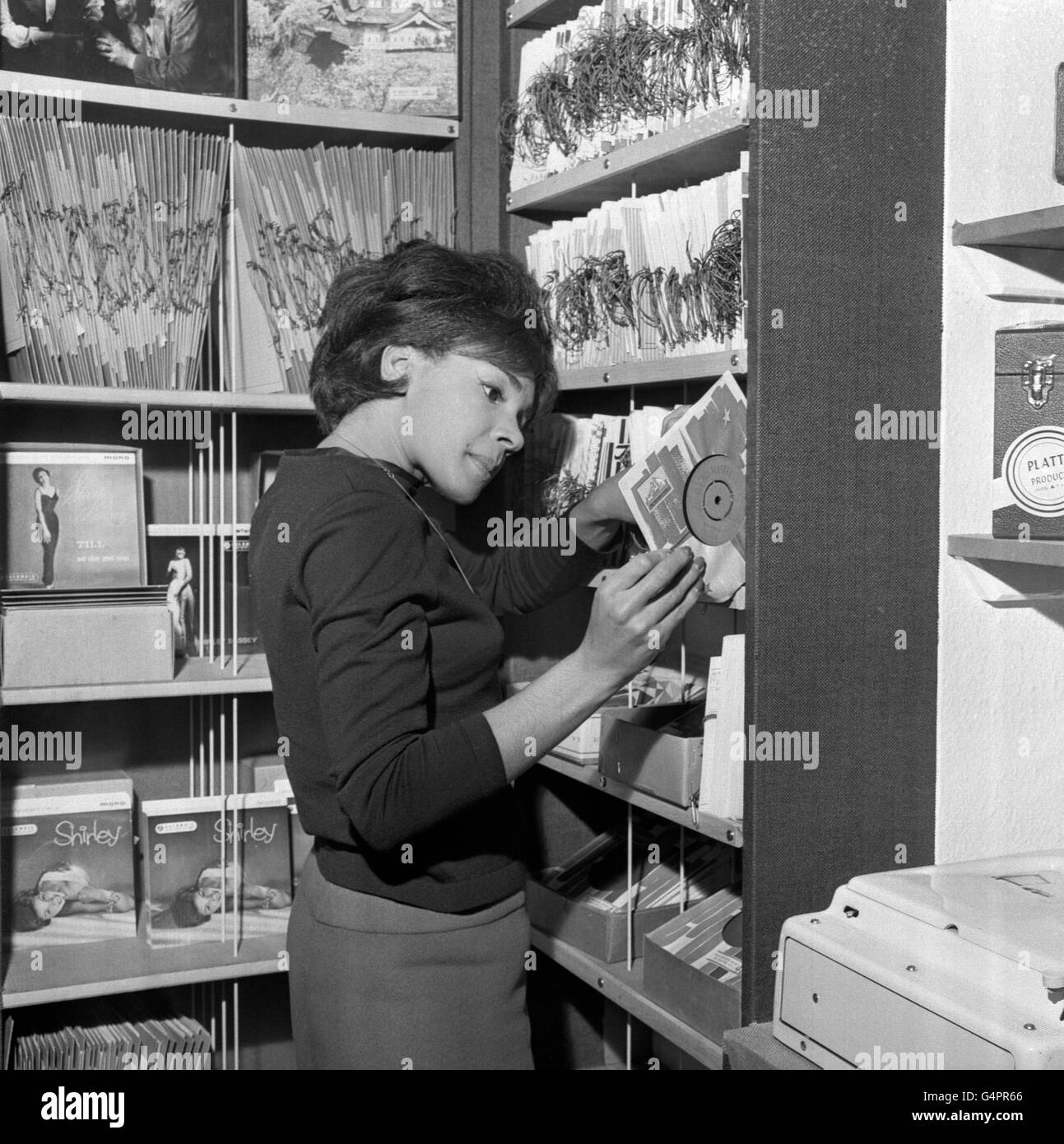 Singer Shirley Bassey browsing at her Record Shop in West End Lane, London. Stock Photo