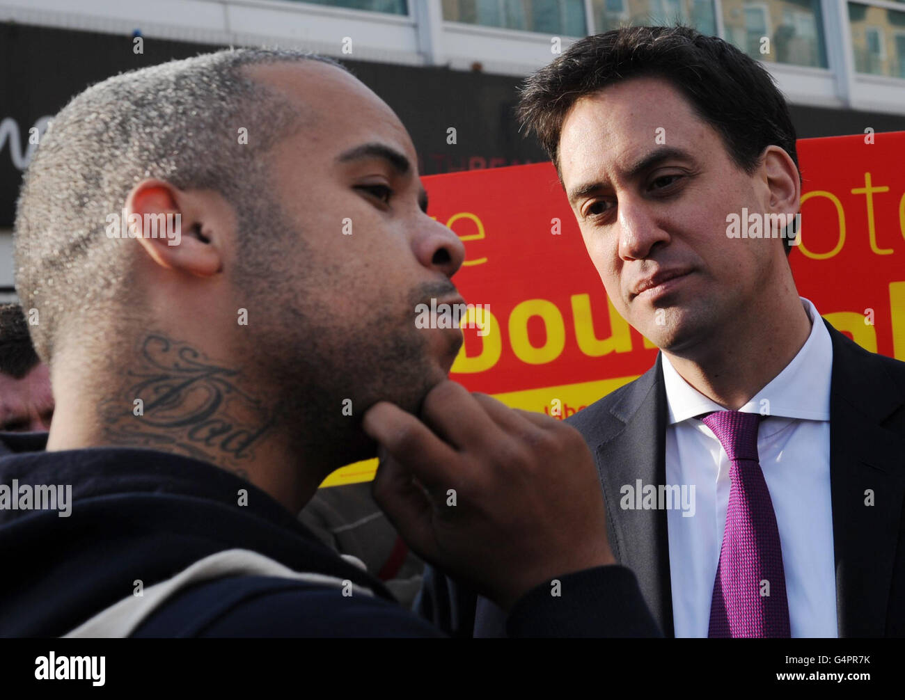 Labour leader Ed Miliband speaks to a member of the public (name not given) in Feltham as he campaigns ahead of next weeks Feltham and Heston by-election. Stock Photo