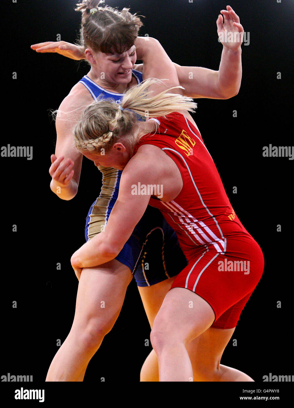 Sweden's Jenny Franson (red) in action against Russia's Ekaterina Bukina during the women's freestyle wrestling during the London Olympic Games 2012 Test Event at the Excel Arena, London. Stock Photo