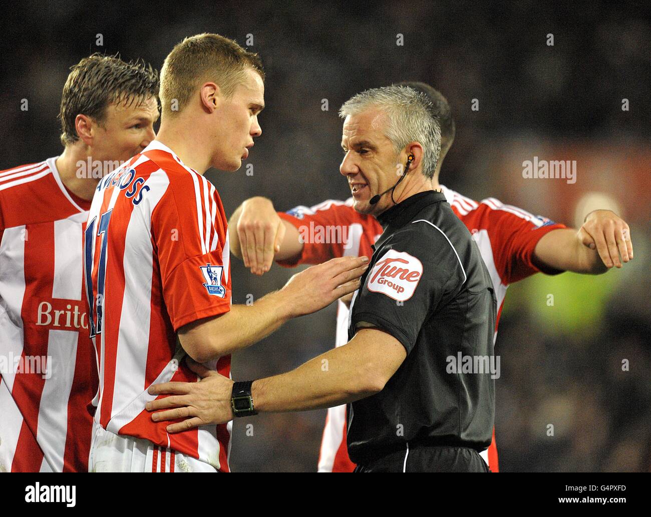 Stoke City's Ryan Shawcross (second left) speaks with match referee Chris Foy after Tottenham Hotspur were awarded a penalty Stock Photo