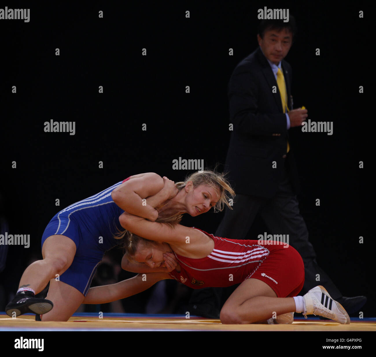 Germany's Aline Focten (right) during her bout against Latvia's Laura Skujina (left) during Bronze bout at 63kg during the London Olympic Games 2012 Test Event at the Excel Arena, London. Stock Photo