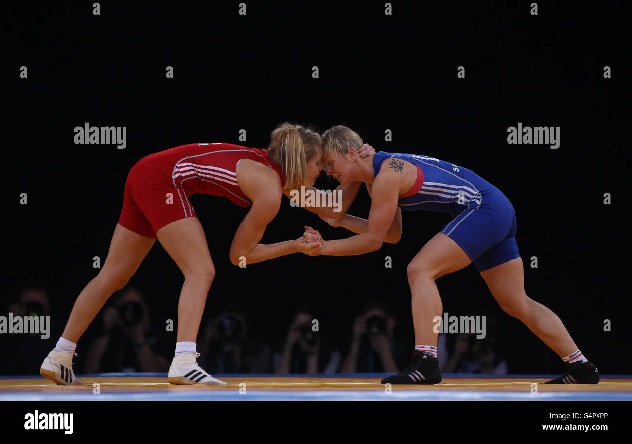 Germany's Aline Focten (left) during her bout against Latvia's Laura Skujina (right) during Bronze bout at 63kg during the London Olympic Games 2012 Test Event at the Excel Arena, London. Stock Photo