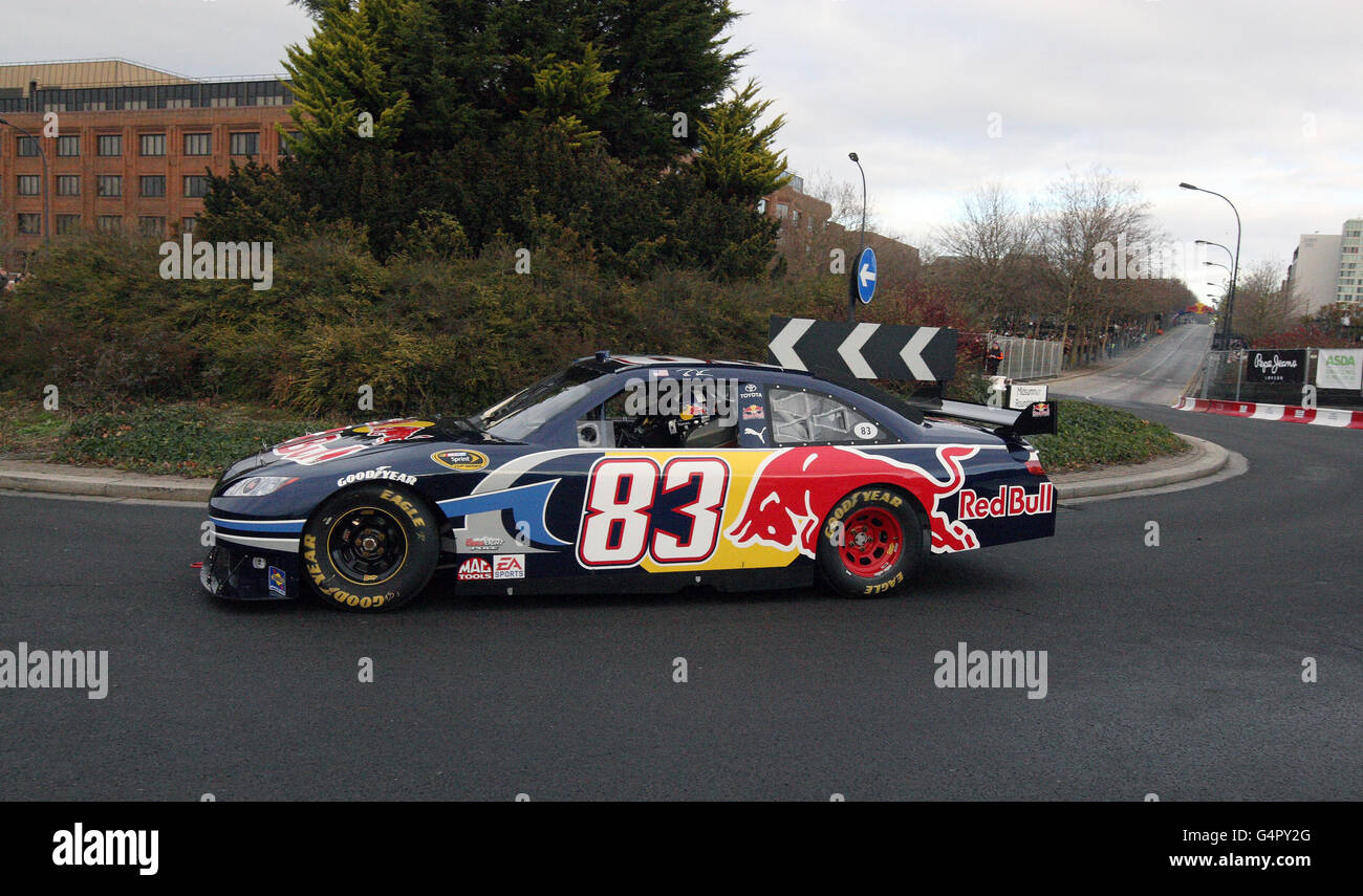 David Coultard drives a Red Bull Nascar down Midsummer Boulevard in Milton Keynes Stock Photo