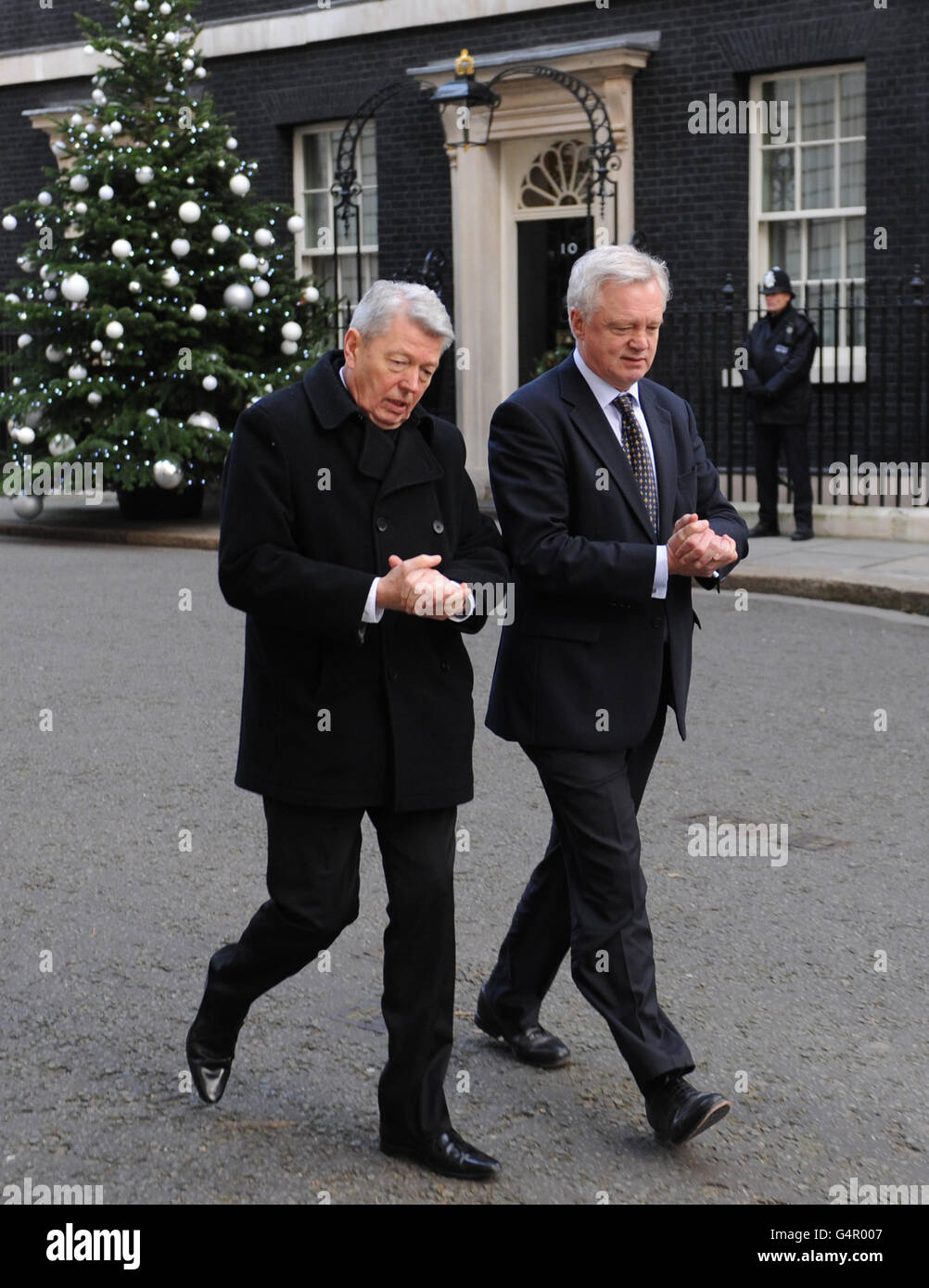 MPs Alan Johnson (left) and David Davis (right) after they handed a petition in at 10 Downing Street, London, with workers and family members from BAE Systems Brough factory in an attempt to halt the planned closure of the plant near Hull. PRESS ASSOCIATION Photo. Picture date: Wednesday December 14, 2011. See PA story INDUSTRY Lobby. Photo credit should read: Stefan Rousseau/PA Wire Stock Photo