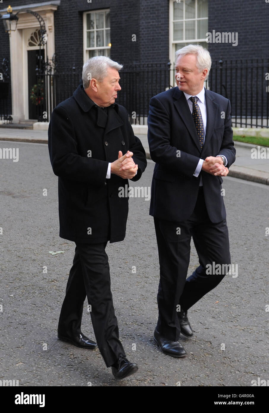 MPs Alan Johnson (left) and David Davis (right) after they handed a petition in at 10 Downing Street, London, with workers and family members from BAE Systems Brough factory in an attempt to halt the planned closure of the plant near Hull. PRESS ASSOCIATION Photo. Picture date: Wednesday December 14, 2011. See PA story INDUSTRY Lobby. Photo credit should read: Stefan Rousseau/PA Wire Stock Photo