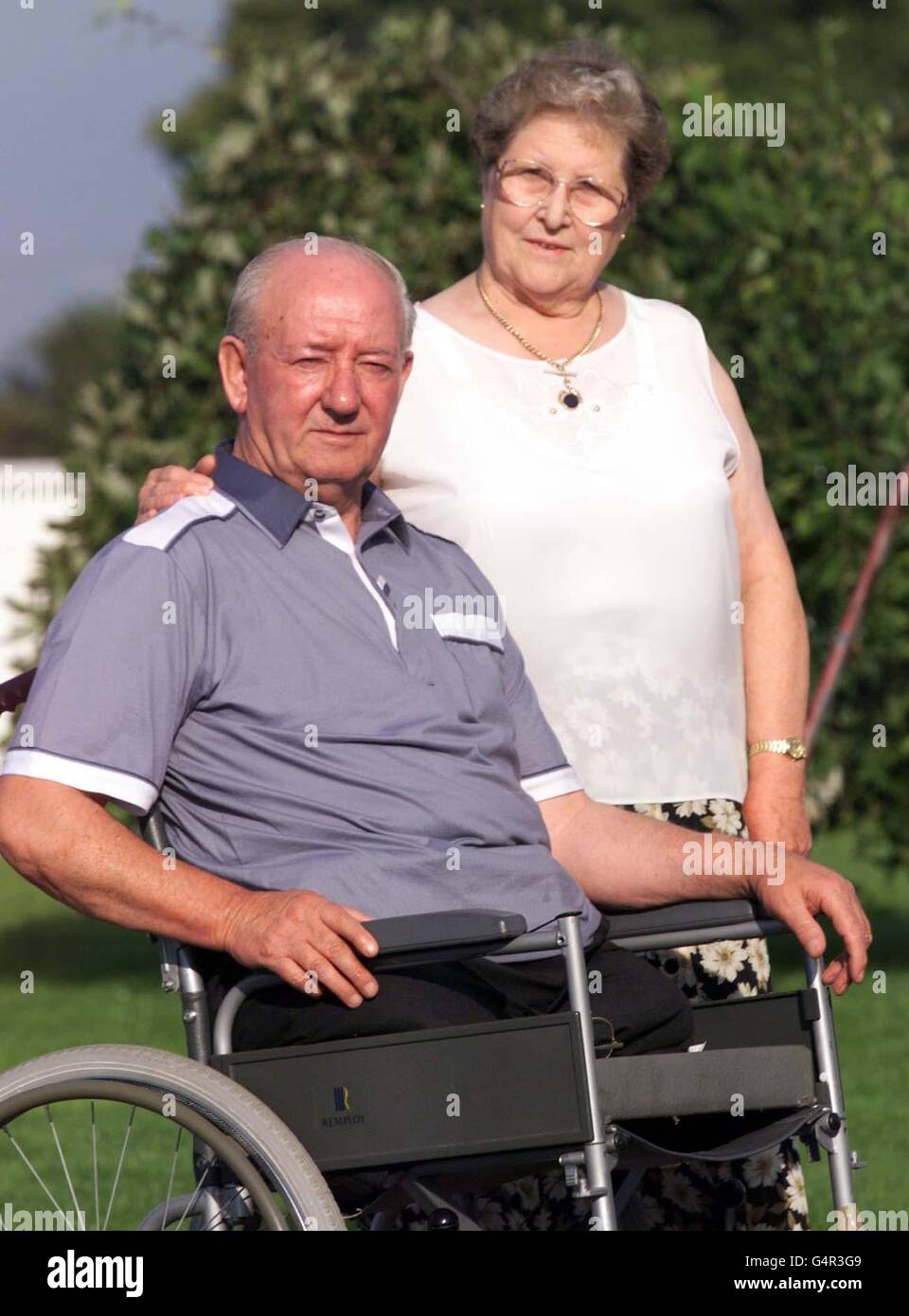 Ronnie Pollock with his wfe Georgie outside their County Down home. Mr Pollock, 70, a former policeman lost his legs when a booby trap bomb exploded under his car in 1981. Stock Photo