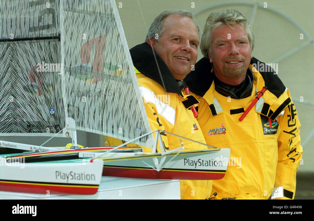 World Record sailing skipper Steve Fossett (L) with the latest member of his crew, Richard Branson and a model of Steve's maxi-catamaran PlayStaion at a photocall in London, ahead of their October challenge to the TransAtlantic sailing record. Stock Photo