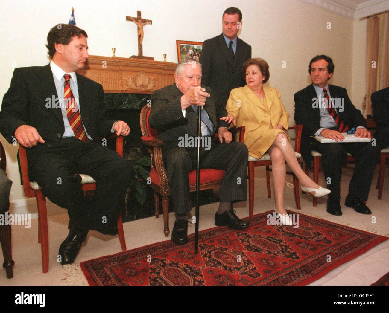 General Augusto Pinochet with his wife Lucia with a delegation of Chilian Senator's and Business leaders during a meeting which marks the 26th anniversary of the military coup which bought him to power. The delegation met at his home in Wentworth Surrey. * The meeting was held just a week before the extradition hearing which could see him sent to Spain to face torture charges.. Stock Photo