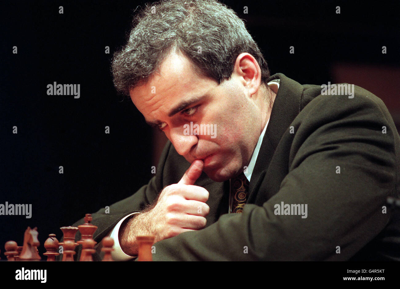 World Chess champion Gary Kasparov contemplates his next move against the Pentium procecessor based PC with Fritz4 software, in the deciding match of Man v Machine, in London. The machine beat Kasparov in 1994, but he went on to avenge his defeat in May 1995. Stock Photo