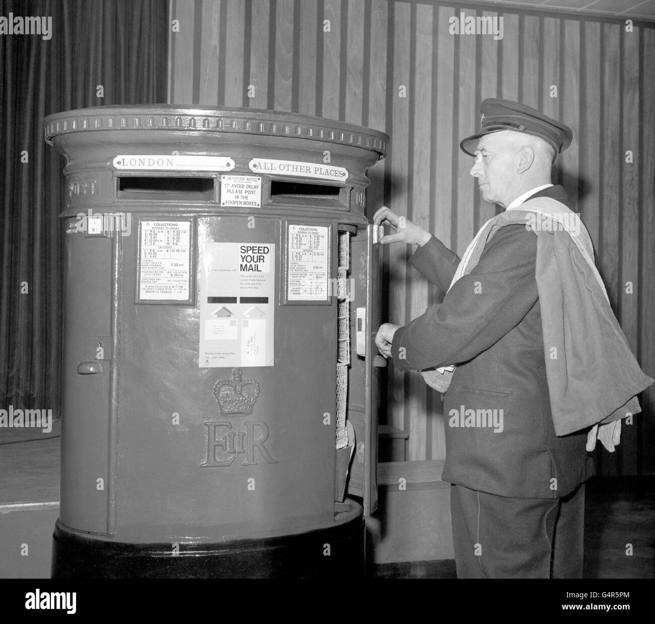 The new double-mouthed pillar box demonstrated at the GPO in London, which will be used to speed up the mail in Central London. One section is for London letters, the other for 'all other places'. But, of course, the scheme depends upon mail being placed in the correct box. Stock Photo