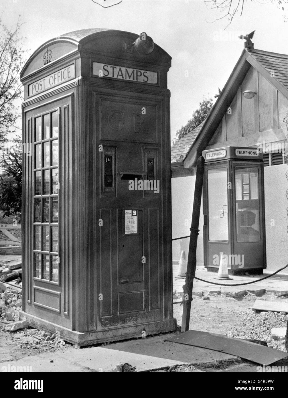 For more than 40 years this box has supplied a telephone service, postal and stamp facilities, outside the Newton Abbot railway station in Devon. Now it's giving way to a modern kiosk (right) and will find a home in the Post Office museum in Somerset. Stock Photo